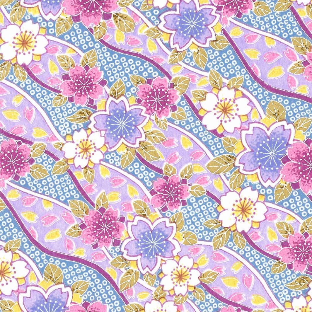 carré de 10cm par 10cm de papier japonais yuzen chiyogami aux motifs d'ondulations fleuries de cerisier et de petits losanges kanoko dans les tons lilas, mauve, bleus et jaunes adeline klam (M1050)