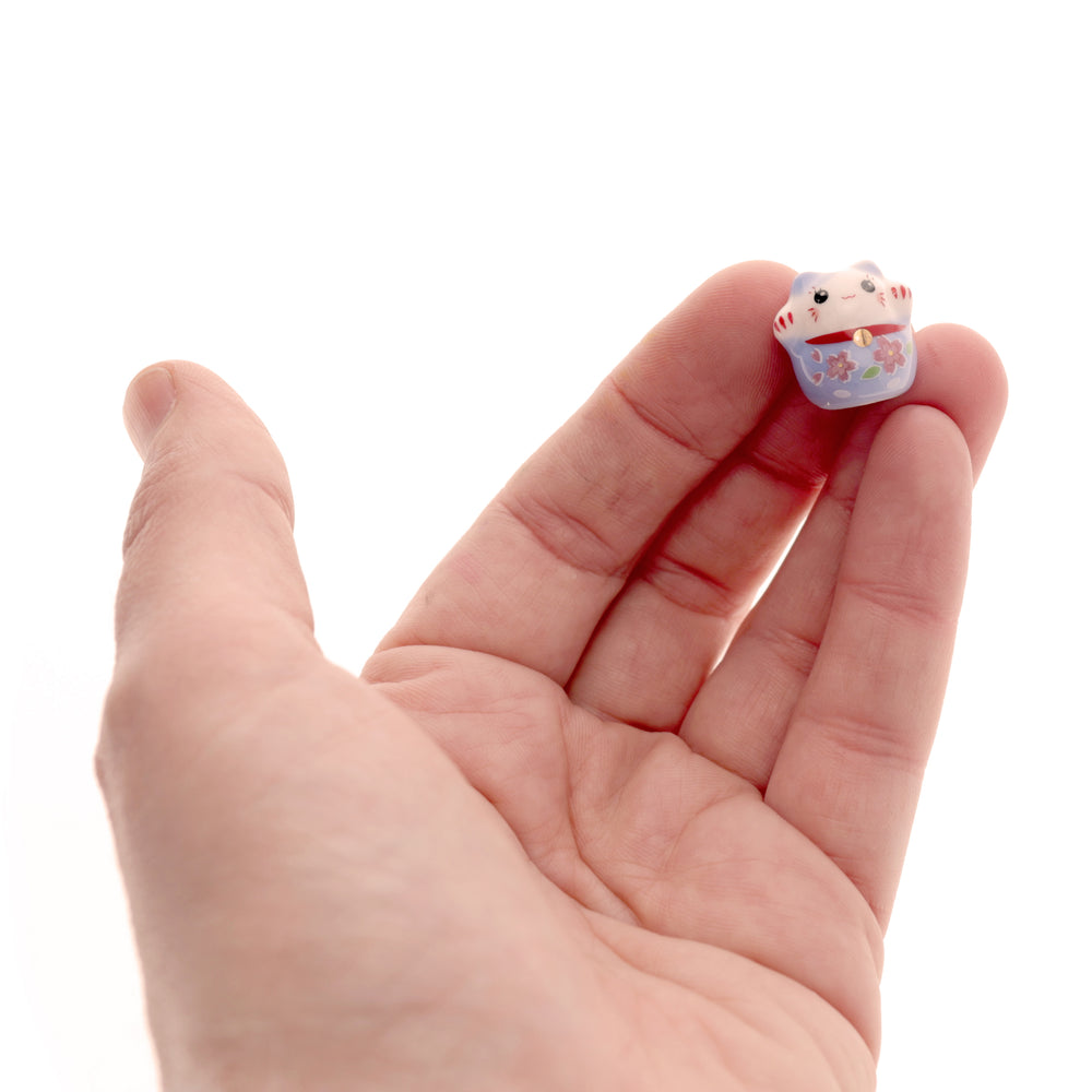 photo de main de perle en céramique en forme de maneki-neko