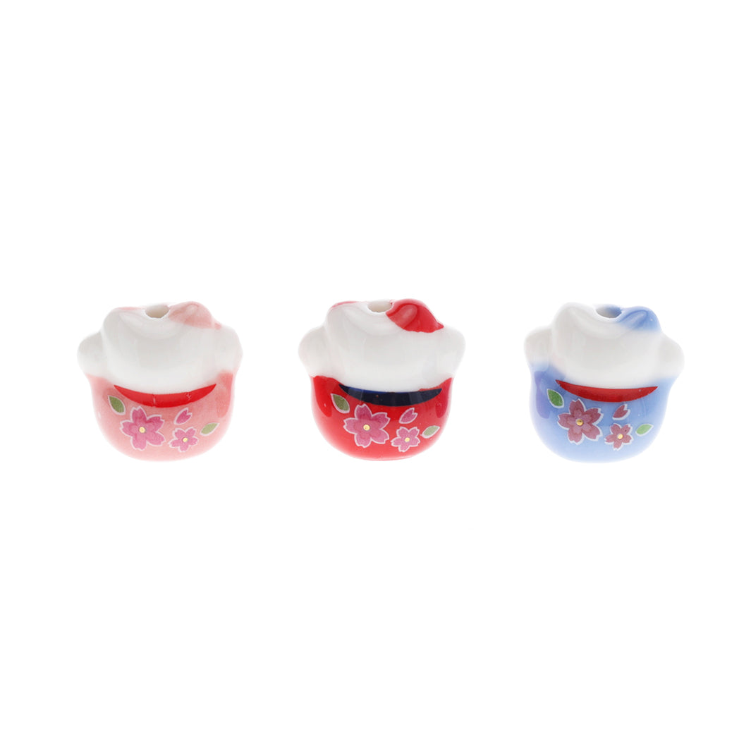 photo de dos de perles en céramique en forme de grand maneki-neko