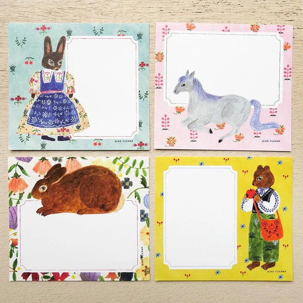 photo packshot du détail des 4 motifs du bloc-notes de 120 feuilles « flower and animals » par Mariko Fukuoka pour Cozyca Products