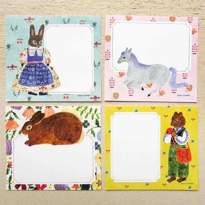 photo packshot du détail des 4 motifs du bloc-notes de 120 feuilles « flower and animals » par Mariko Fukuoka pour Cozyca Products