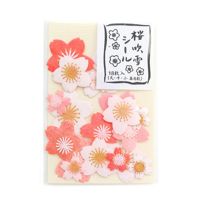 photo packshot de face du packaging du lot de 18 stickers en forme de fleurs de cerisier dans différents tons de roses adeline klam
