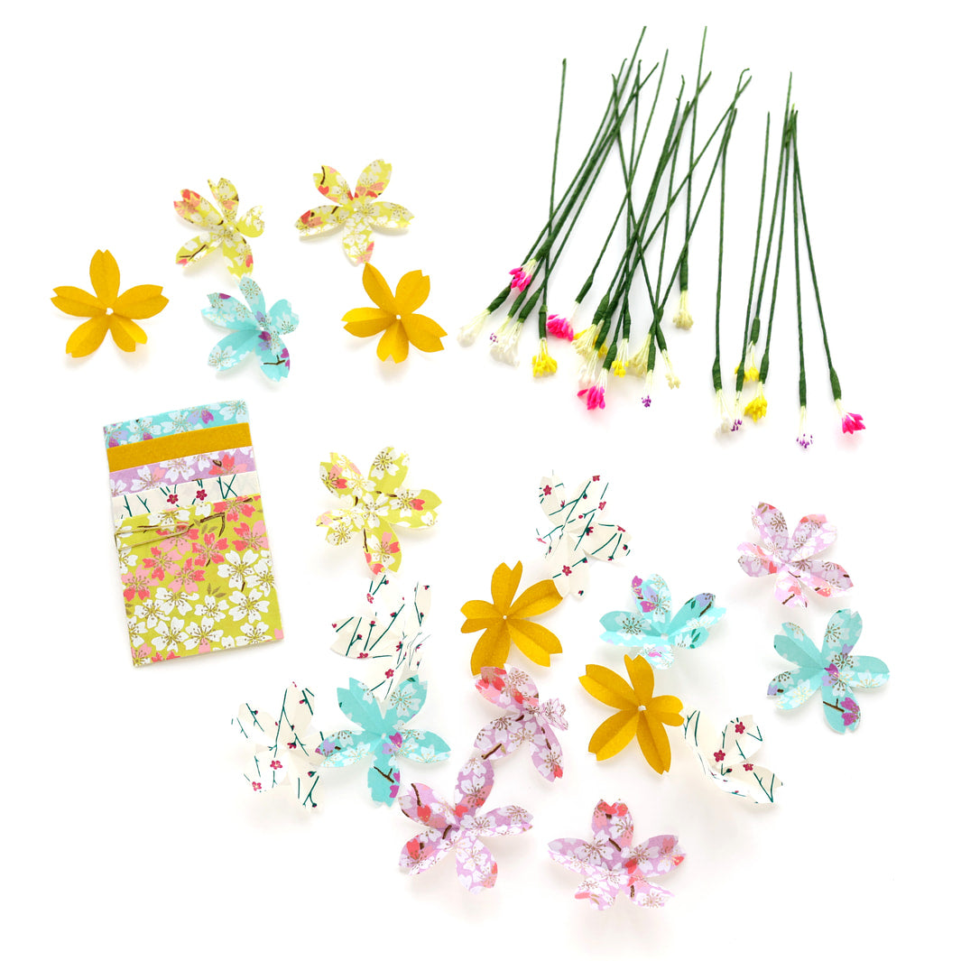 photo packshot des fleurs fabriquées du kit bouquet de fleurs de cerisier dans les tons vert menthe, jaune moutarde et acidulé, violet mauve et roses « berlingot » adeline klam