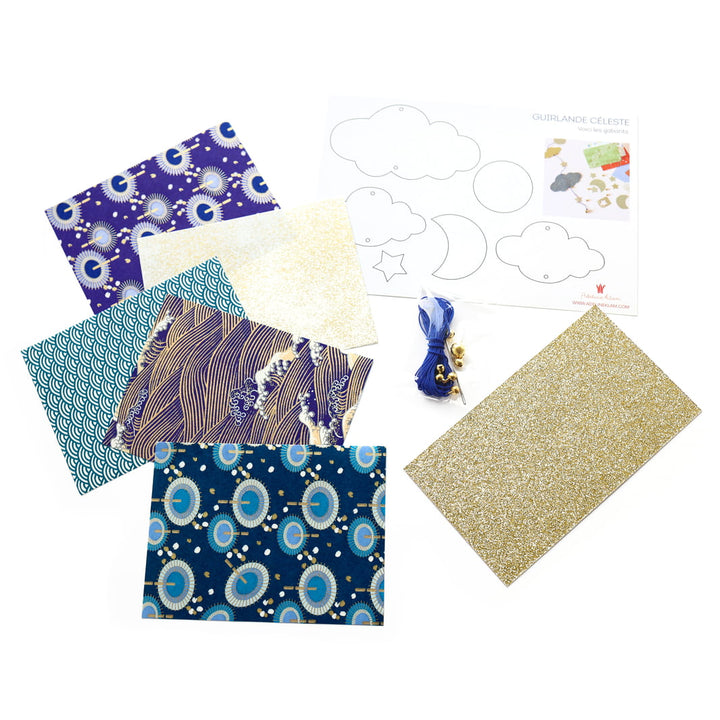photo packshot des fournitures du kit guirlande de nuages « céleste » dans les tons bleu nuit et marine, blancs et dorés « cosmique » adeline klam