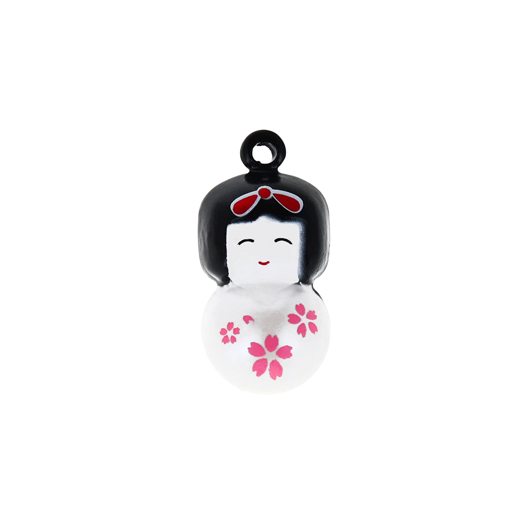 photo packshot d'un grelot en forme de kokeshi blanc nacré