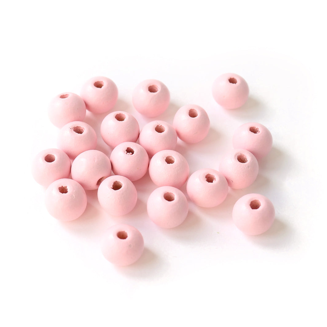 photo packshot d'un lot de 20 perles en bois métallisée de 10mm de diamètre de couleur rose bébé clair