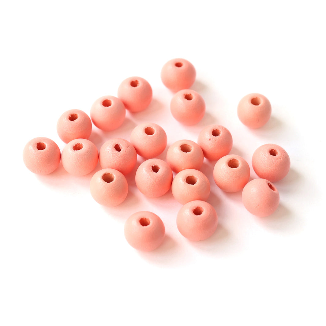 photo packshot d'un lot de 20 perles en bois métallisée de 10mm de diamètre de couleur rose corail