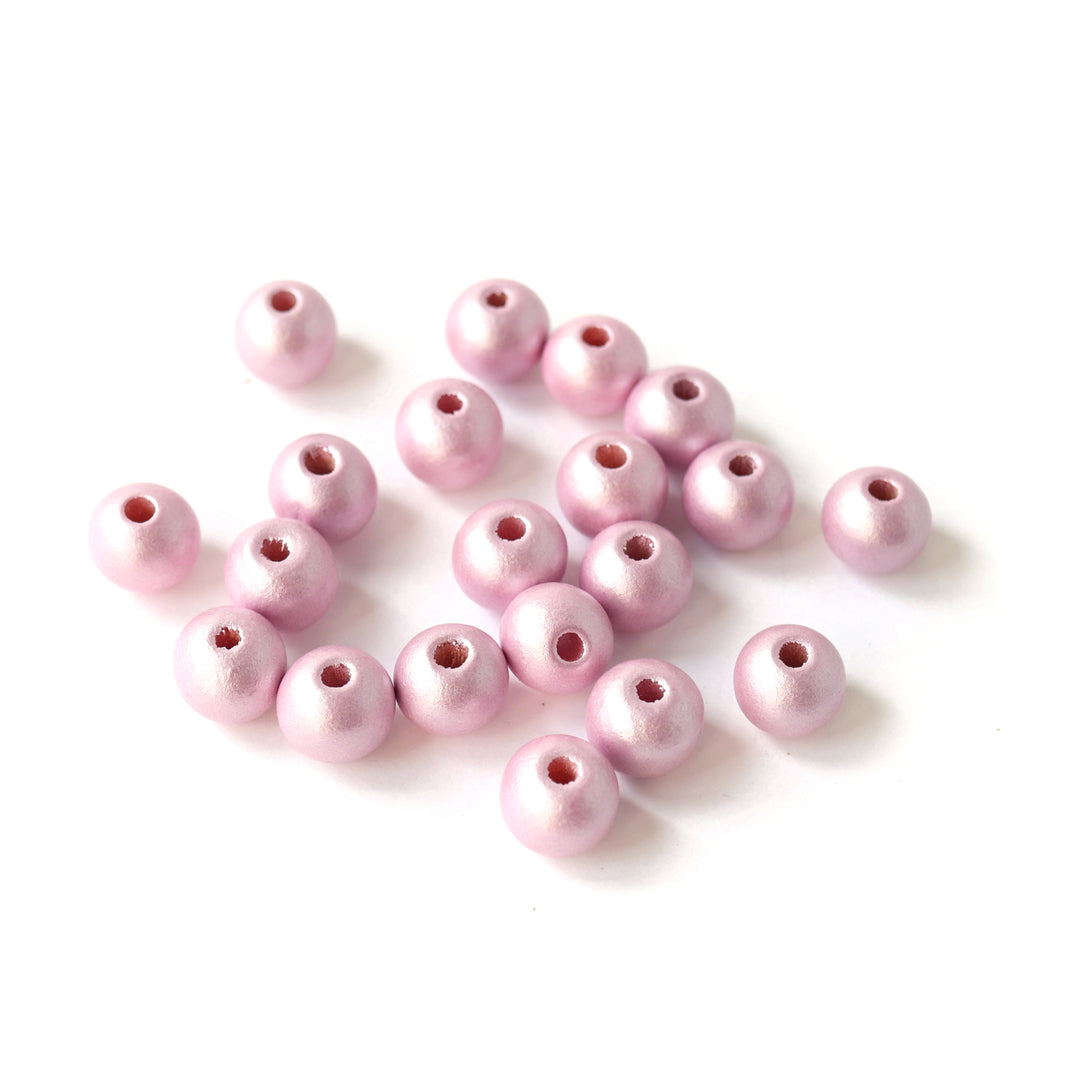 photo packshot d'un lot de 20 perles en bois métallisée de 10mm de diamètre de couleur rose mauve clair métallisée