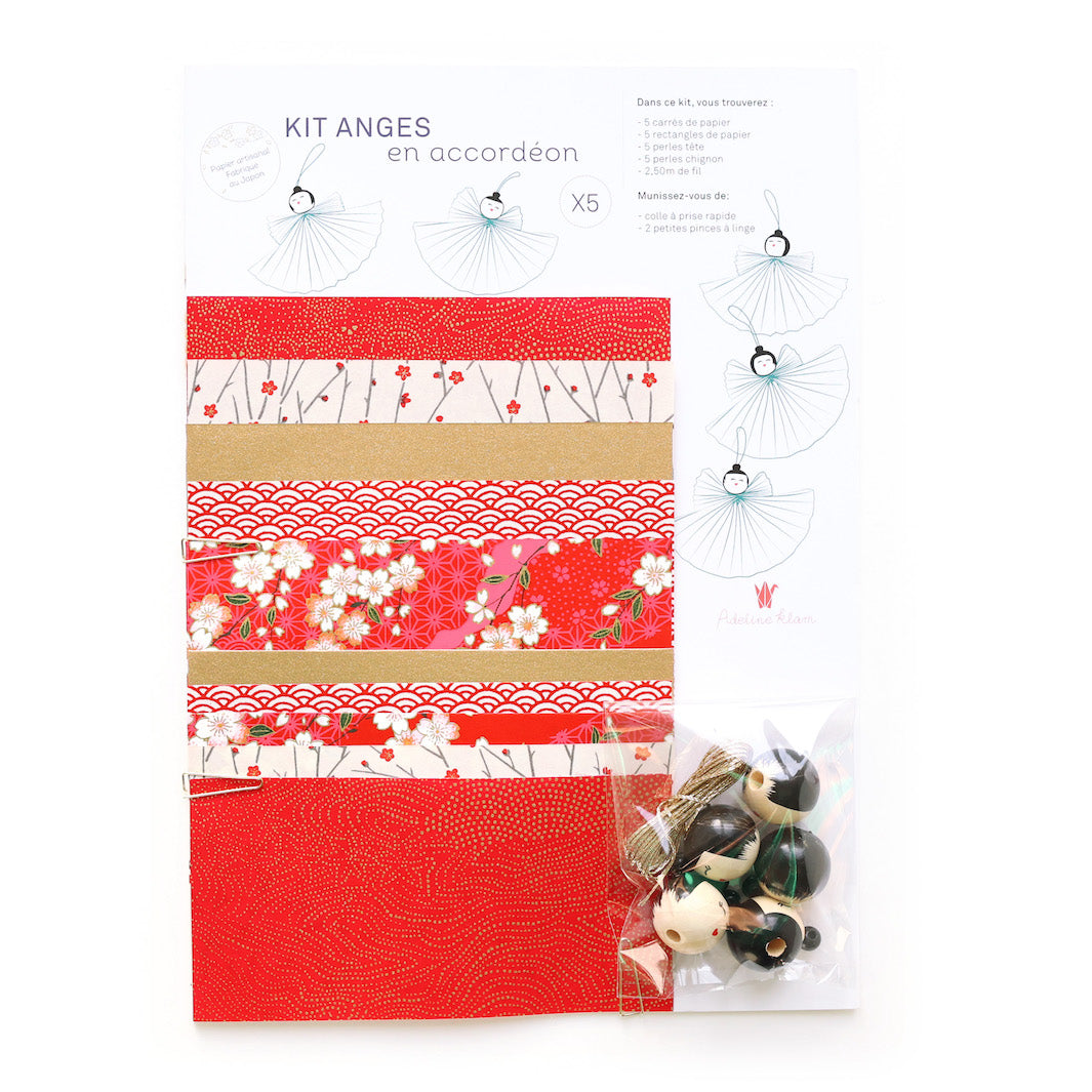 photo packshot du matériel du kits anges « accordéons » dans les tons rouges, dorés, blancs et noirs de la gamme « nouvel an » adeline klam