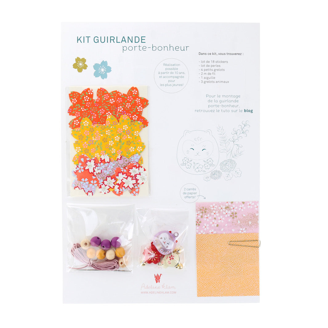 photo packshot du packaging du kit guirlande porte-bonheur jaune, rose, mauve et rouge « pondichéry » adeline klam