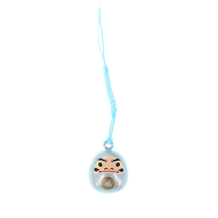 photo packshot d'un porte-clefs en forme de daruma de couleur bleu ciel nacré