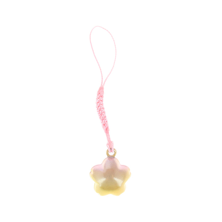 photo packshot d'un porte-clefs en forme de fleur de cerisier de couleur jaune et rose nacré