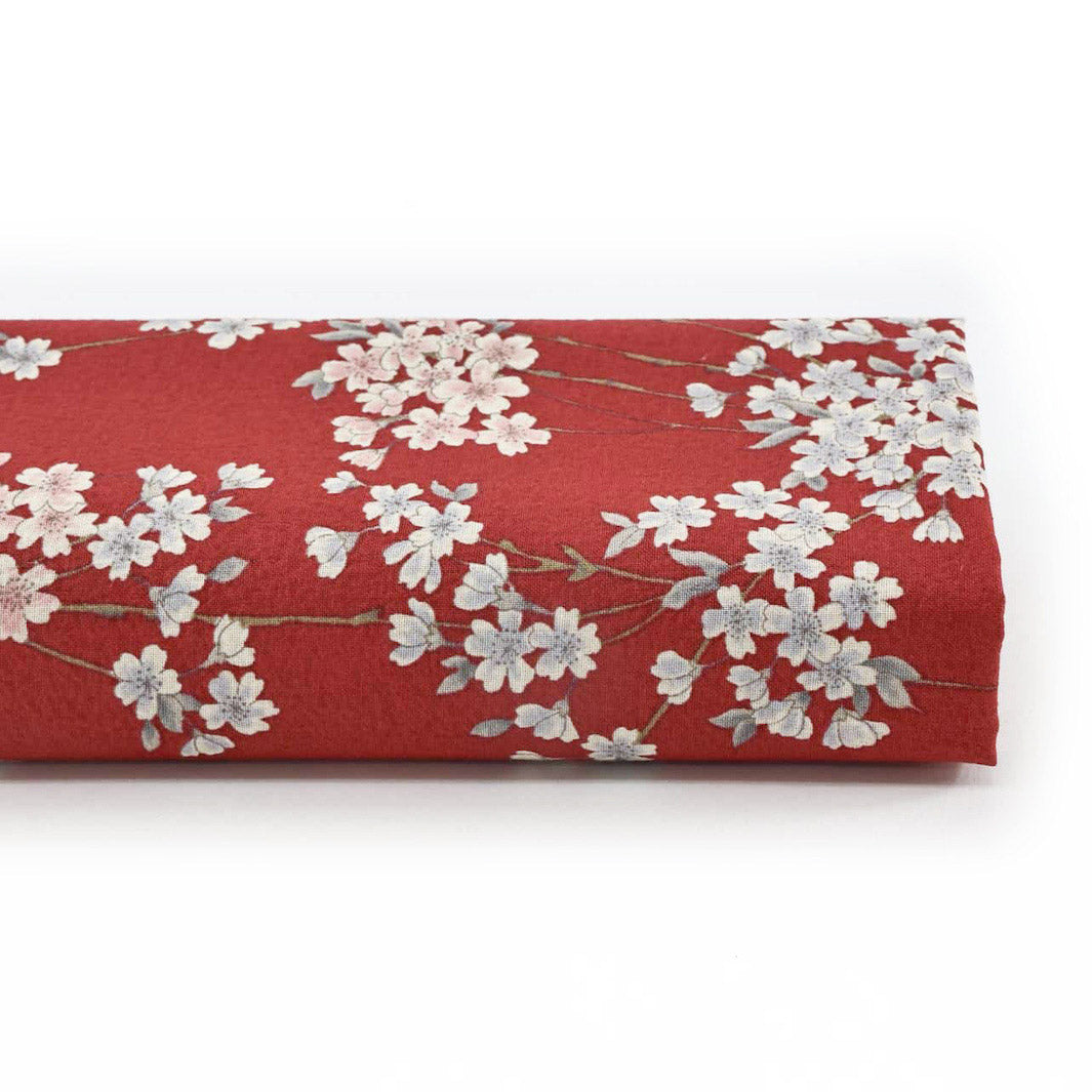 photo packshot du rouleau du tissu japonais aux motifs de fines branches de fleurs de cerisier dans les tons rouge sombre, gris clair et rose pâle T358