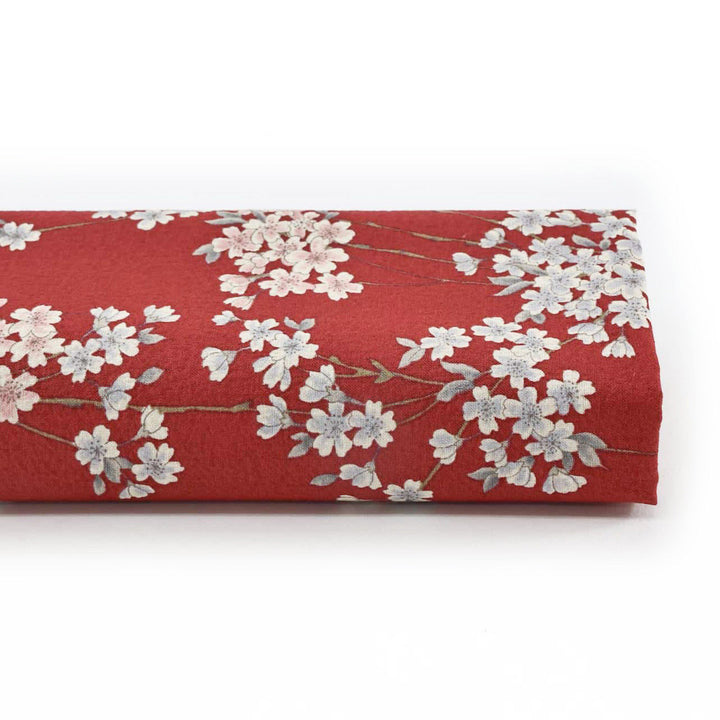 photo packshot du rouleau du tissu japonais aux motifs de fines branches de fleurs de cerisier dans les tons rouge sombre, gris clair et rose pâle T358