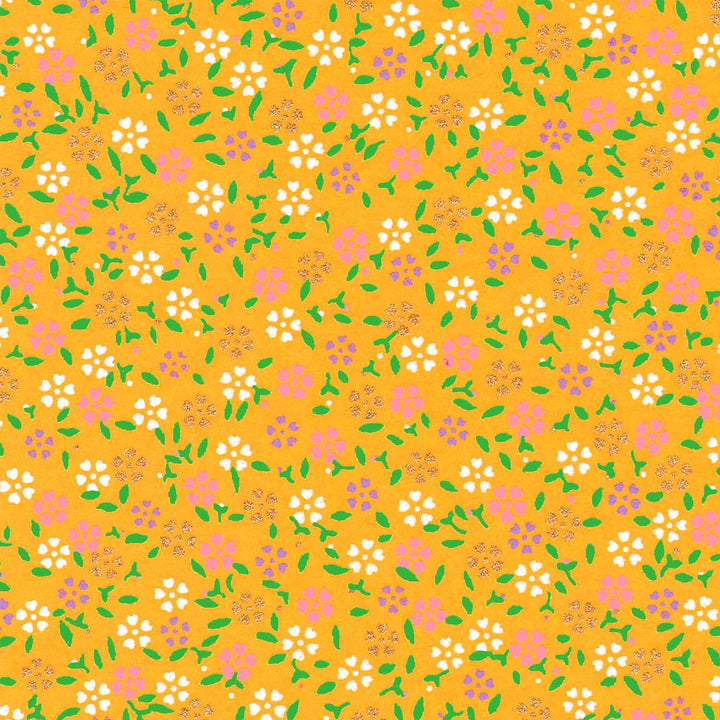 papier japonais aux motifs de mini fleurs de cerisier blanches, roses, mauve et dorées et feuilles vertes sur fond jaune moutarde adeline klam de 10cm par 10cm