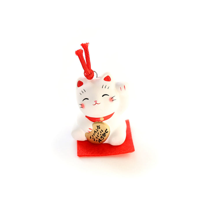 petit grigri grelot maneki neko blanc et rouge posé