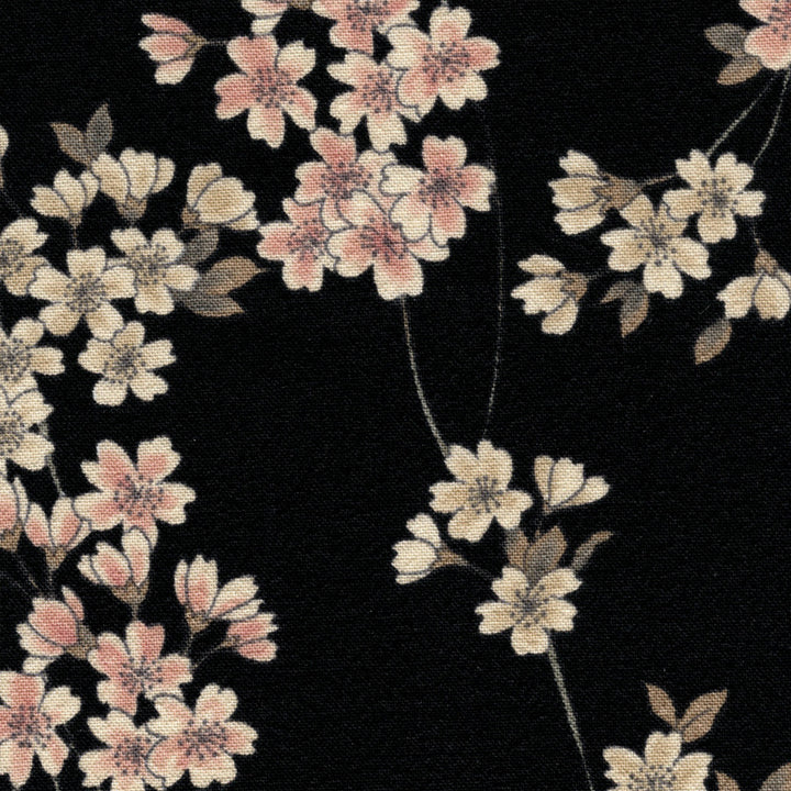 photo packshot du tissu japonais aux motifs de fines branches de fleurs de cerisier dans les tons noirs, crème et rose clair T333